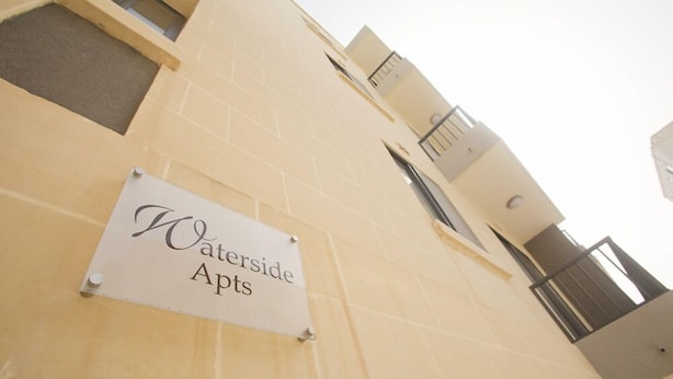 A building with a sign reading "Waterside Apts." - Waterside Apartments (Zebbug)