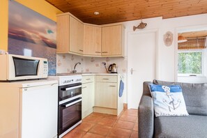 Fridge, microwave, oven, dining tables