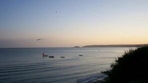 A calm sea with boats and a distant shoreline. - Anchors Away - One Bedroom Cottage, Sleeps 2 (Downderry)