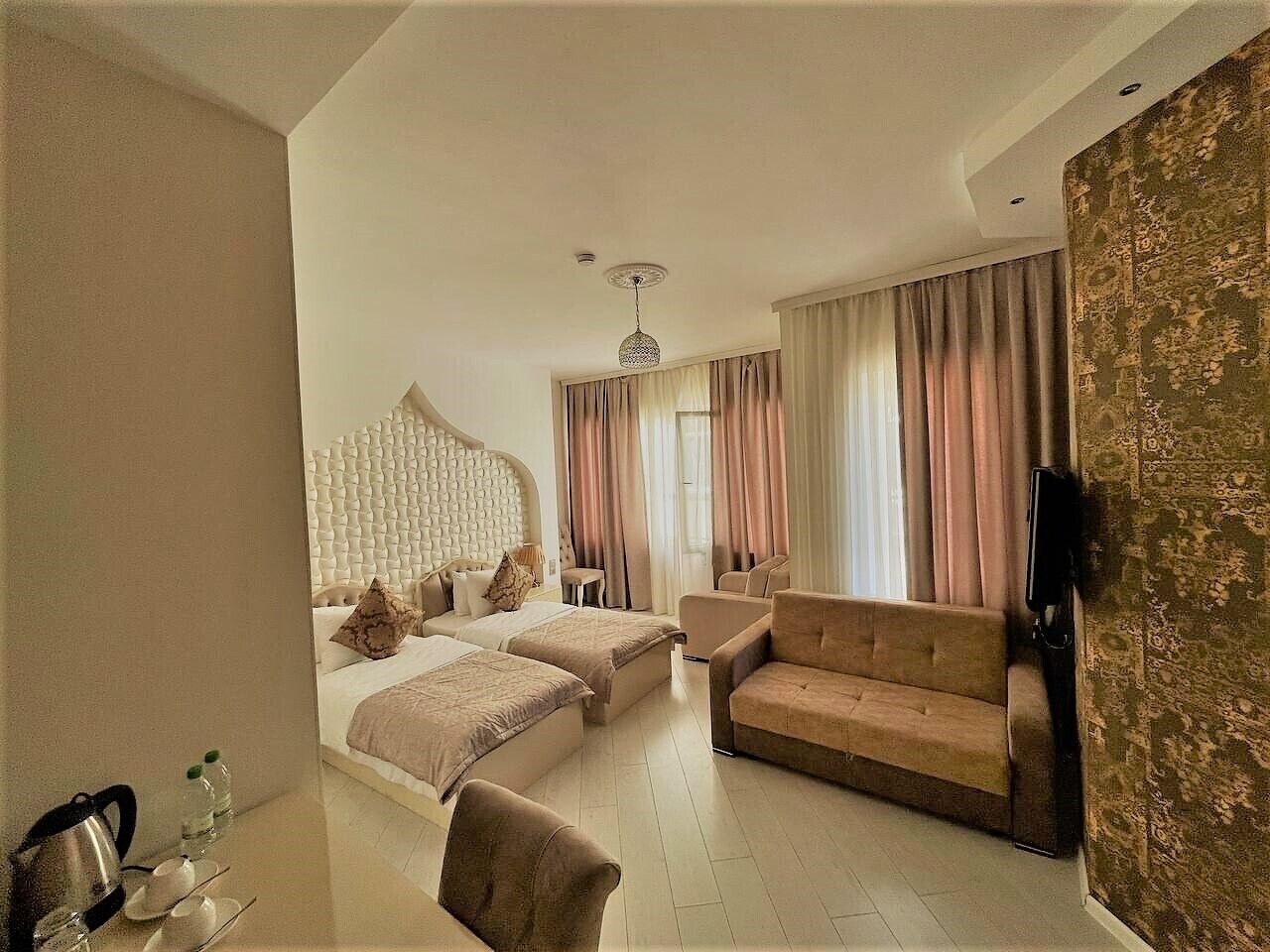 family suite, multiple beds, partial sea view | premium bedding, pillow-top beds, in-room safe, individually decorated