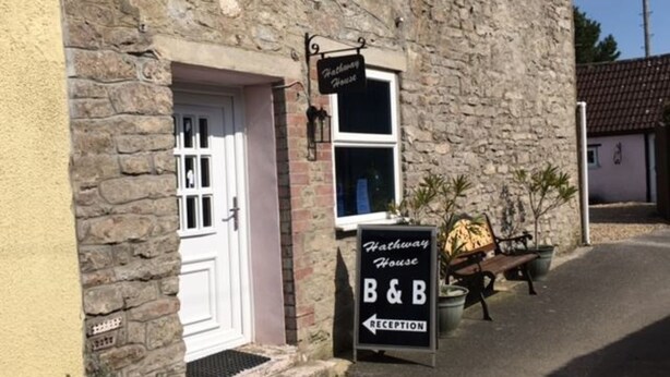 A stone building with a sign for 'Hathaway House B&B' and a reception area. - Hathway House (Bristol)
