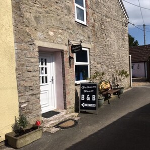 A stone building with a sign for 'Hathaway House B&B' and a reception area. - Hathway House (Bristol)