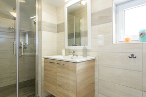 Shower, hair dryer, towels, soap