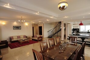 Deluxe Apartment | Living area | 56-inch plasma TV with satellite channels, TV