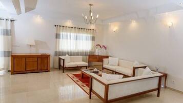 Deluxe Apartment | Living area | 56-inch plasma TV with satellite channels, TV