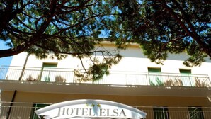 The entrance to HOTEL ELSA with a clear view of the building's facade and balconies. - Elsa (Cervia)