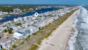 A coastal residential area with beachfront properties, a marina, and a beach. - 710 Canal Upper - Make Everyday a Holiday! (Carolina Beach)