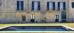 Seasonal outdoor pool, pool umbrellas, pool loungers