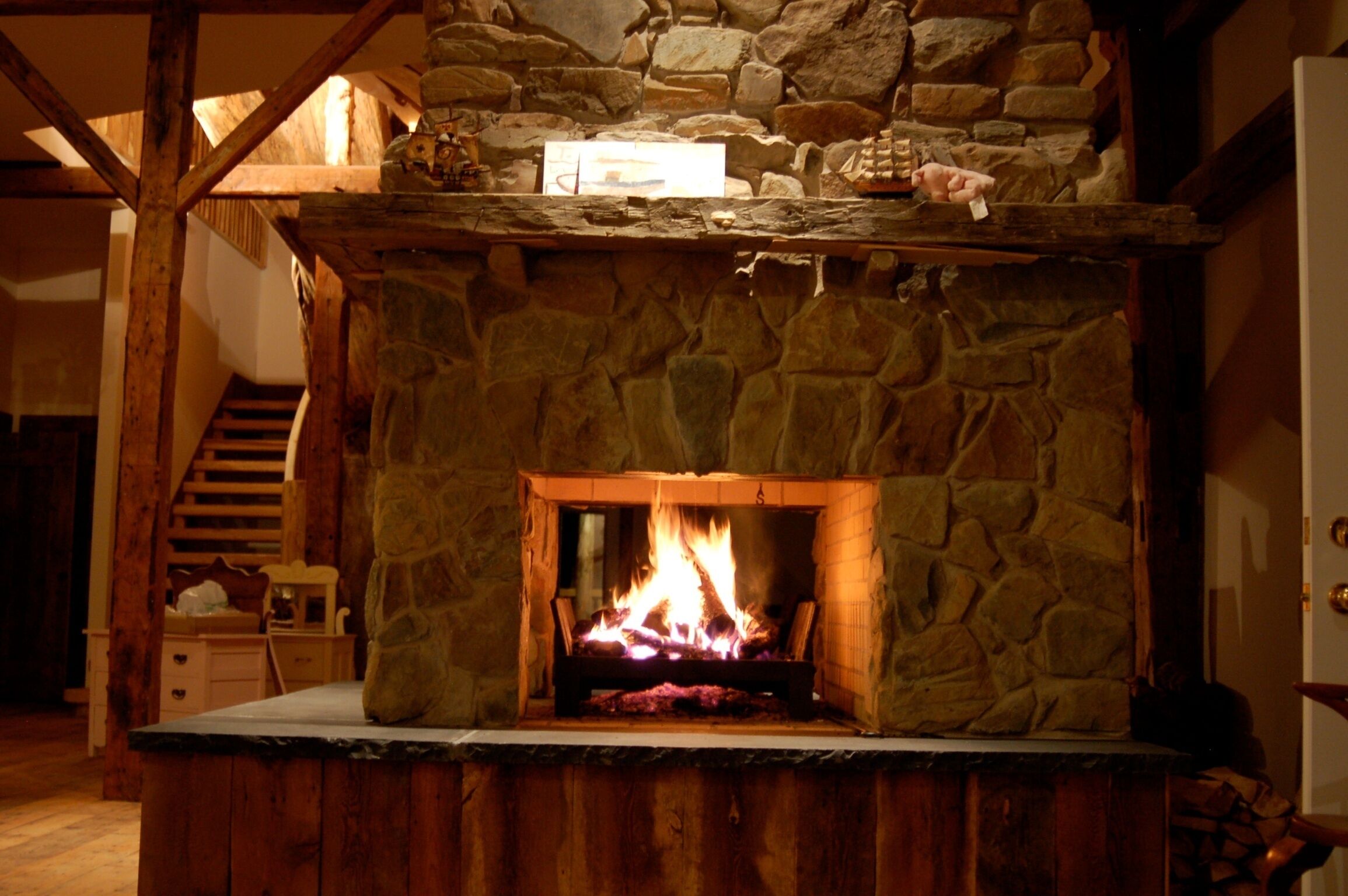 Cozy 3 opening floor to ceiling fireplace.