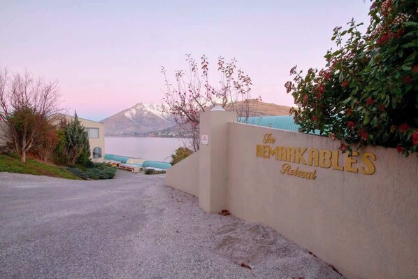 A hotel entrance with a sign reading "The Remarkables Retreat."