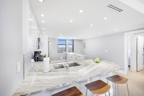 Condo, 1 King Bed with Sofa bed (Elegant beachfront condo in private c) | Private kitchen | Fridge, microwave, oven, stovetop