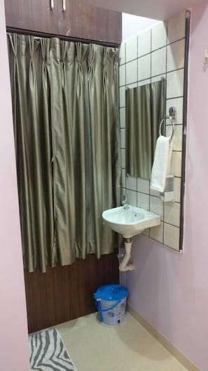 Shower, rainfall showerhead, designer toiletries, slippers