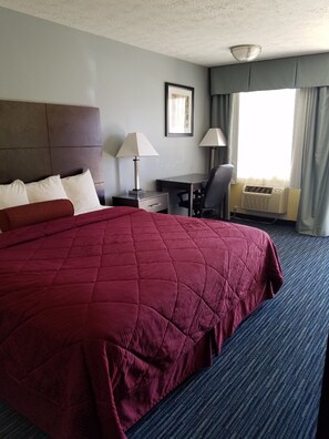 Deluxe Room, 1 King Bed | Iron/ironing board, bed sheets