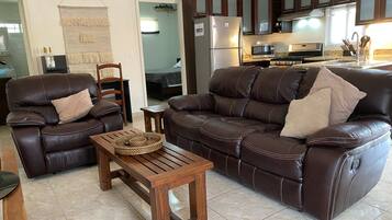 Executive Apartment | Living area | 40-inch plasma TV with digital channels, TV