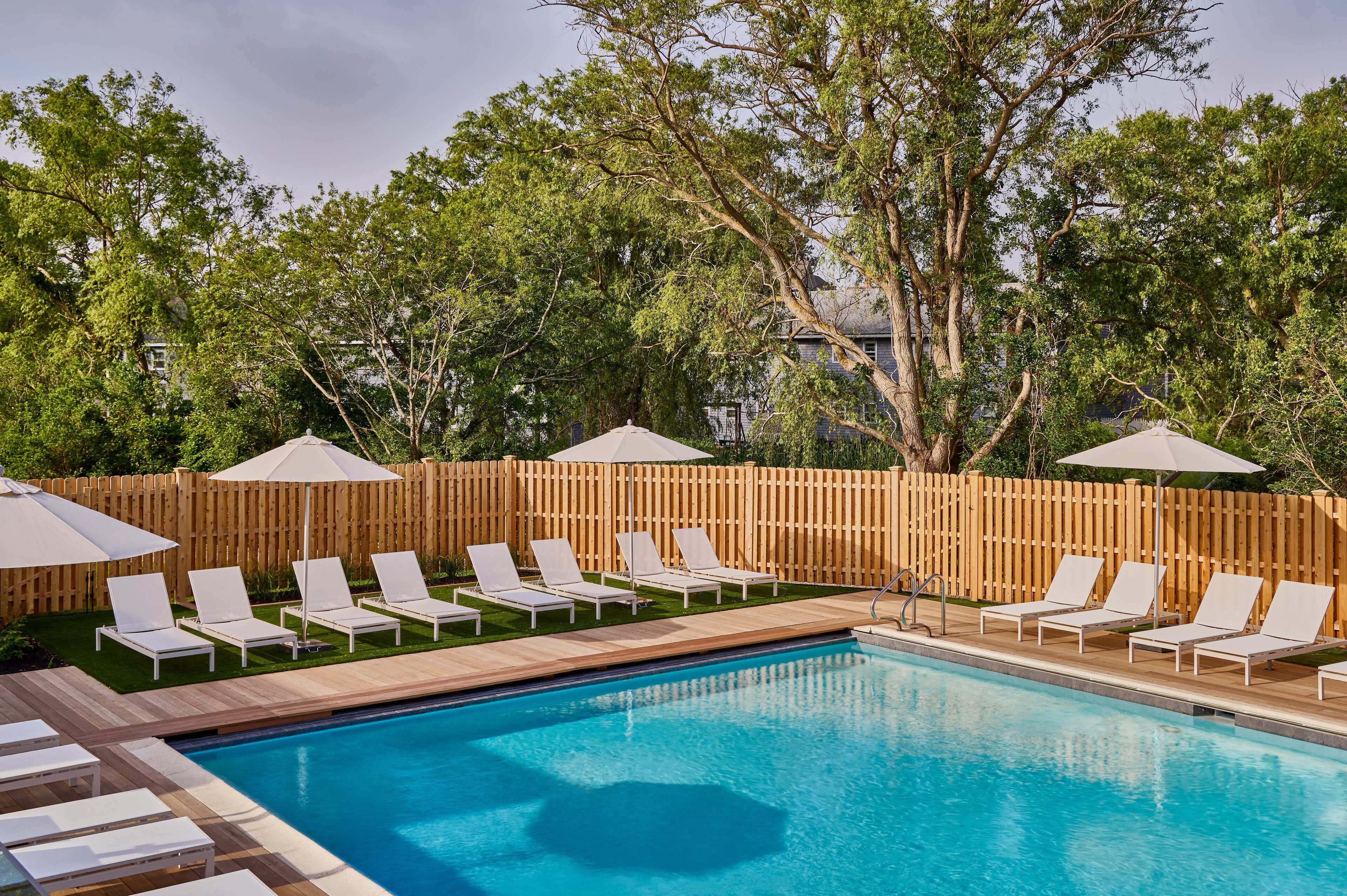 seasonal outdoor pool, open 9:00 am to 8:00 pm, pool umbrellas