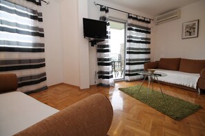 Basic Apartment, Multiple Beds, Sea View | Living area | LCD TV - Paula Apartments (Budva)
