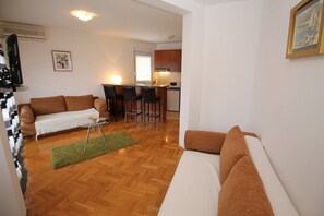 Basic Apartment, Multiple Beds, Sea View | Living area | LCD TV - Paula Apartments (Budva)