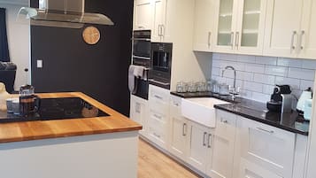 Fridge, coffee/tea maker, electric kettle, cookware/dishes/utensils