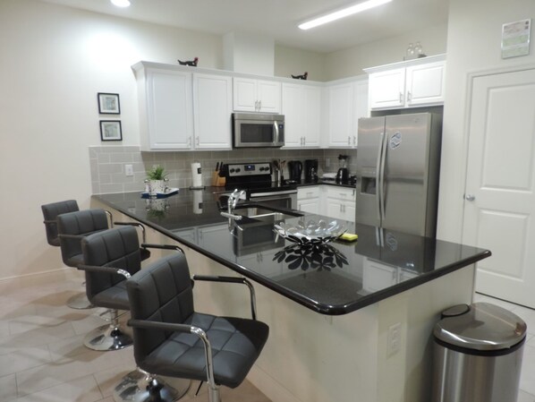Townhome, 4 Bedrooms | Private kitchen | Highchair