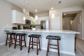 Townhome, 4 Bedrooms | Private kitchen | Microwave, dishwasher