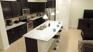 Townhome, 5 Bedrooms | Private kitchen | Highchair - Windsor at Westside 8932 (Kissimmee)