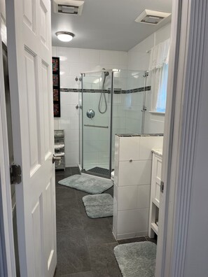 Shower, hair dryer, towels, soap
