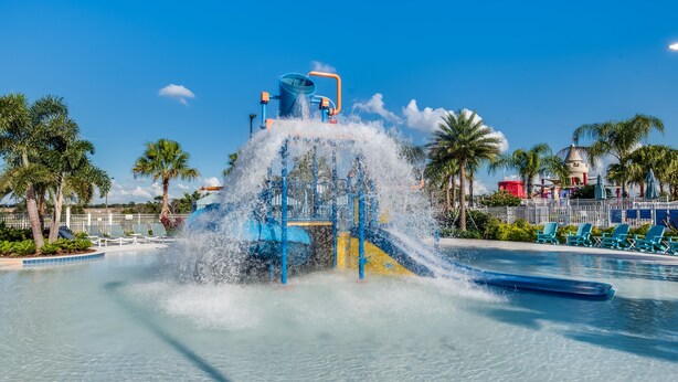A water park with a large water slide and a pool area. - Windsor at Westside 1749 (Kissimmee)