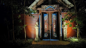 A temple entrance with two statues, a wooden structure, and a sign indicating private property. - Alaya Ascend  |  Seminyak Pool-view Room |  Sunshine Coast Retreat (Eudlo)
