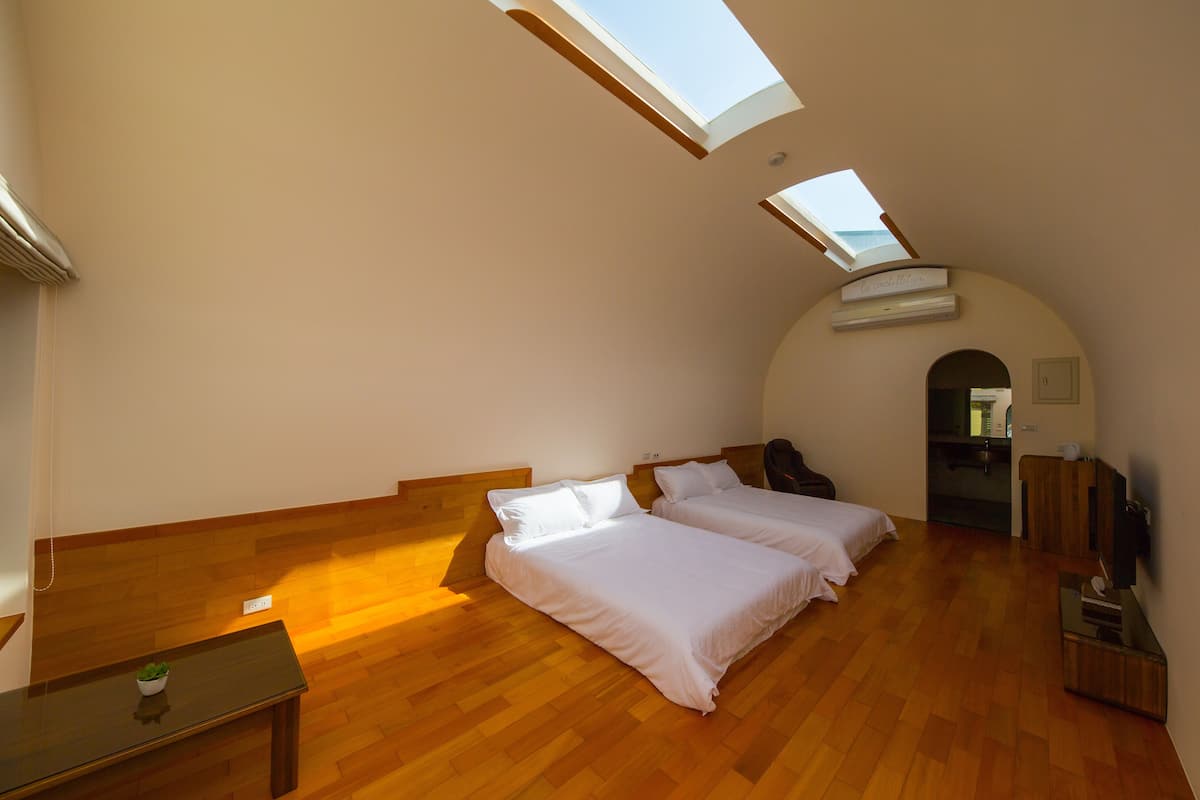 Chambre Quadruple Signature, 2 lits doubles, vue cour intérieure