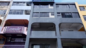 A multi-story building with a 'Hills Residence' sign at the top. - Hotel O Hills Residence (Kuching)