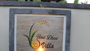 A framed sign with the text "Uma Dhar Villa" and decorative elements. - Uma Dhari Villa (Sukawati)