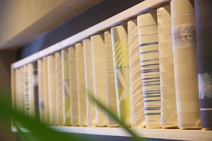 A row of neatly arranged, patterned curtains in a room.