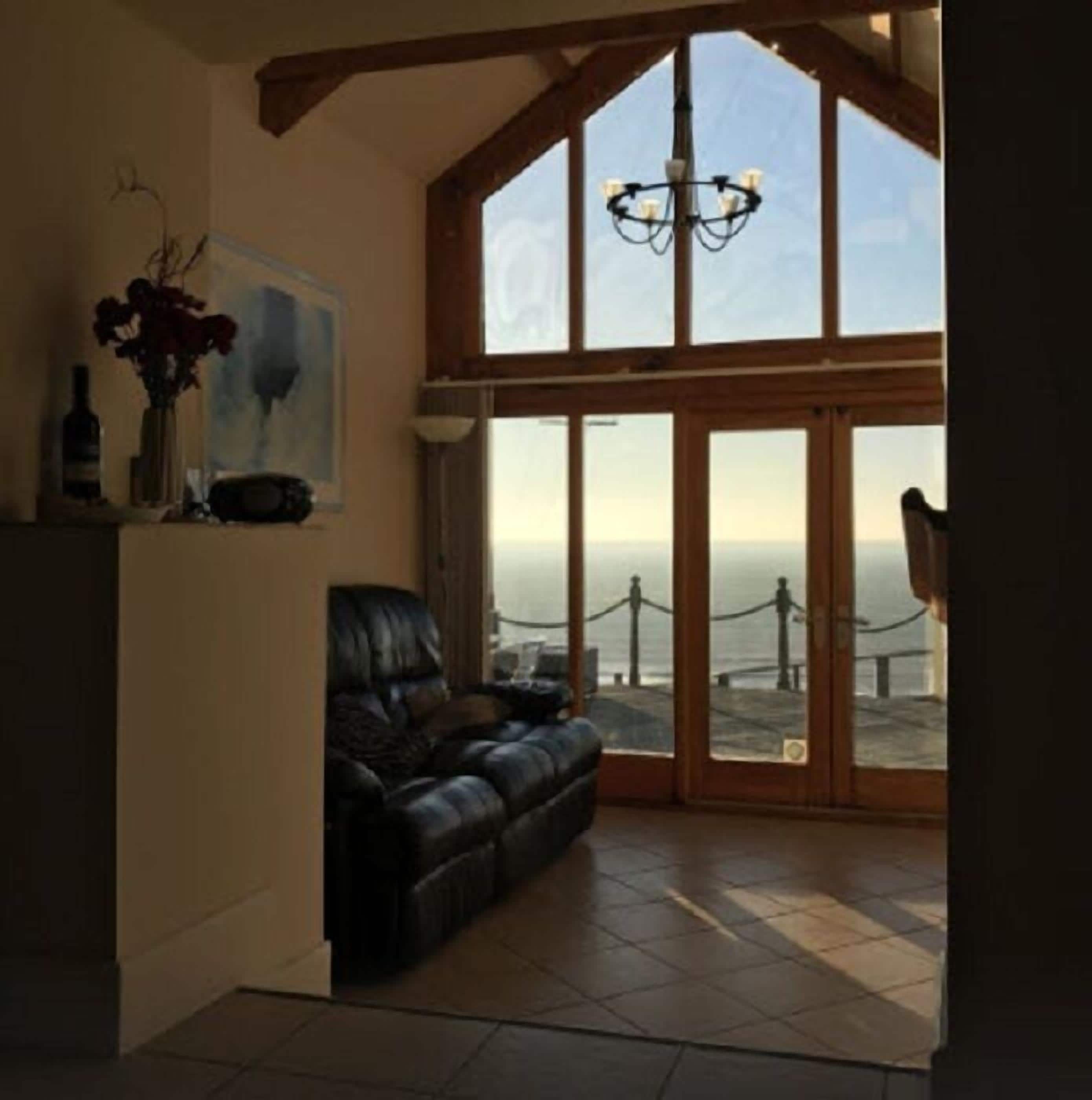 Premier Cottage | Living area | 23-inch flat-screen TV with digital channels, Smart TV, DVD player