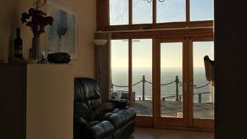 Premier Cottage | Living area | 23-inch flat-screen TV with digital channels, Smart TV, DVD player