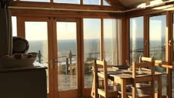 Premier Cottage | Living area | 23-inch flat-screen TV with digital channels, Smart TV, DVD player