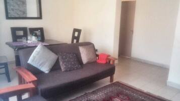 Apartment, 3 Bedrooms | Living area | Flat-screen TV