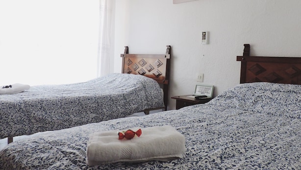 Basic-Doppel- oder -Zweibettzimmer, 2 Einzelbetten | Verdunkelungsvorhänge, kostenlose Babybetten, kostenloses WLAN