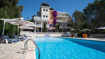 Seasonal outdoor pool, open 8:00 AM to 8:00 PM, pool umbrellas