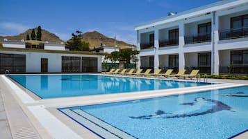 Seasonal outdoor pool, pool umbrellas, pool loungers
