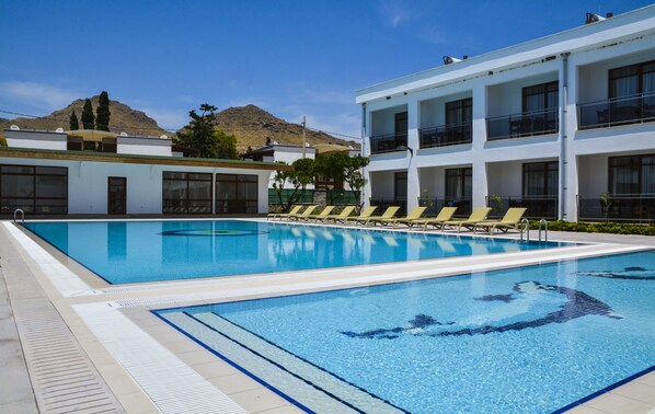 Seasonal outdoor pool, pool umbrellas, pool loungers