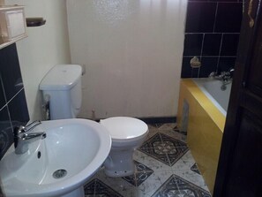 Classic Apartment, 1 Bedroom | Bathroom | Rainfall showerhead, towels - lilis Apartments (Banjul)