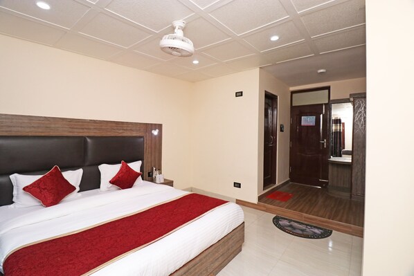 Habitación estándar | Baño | Regadera y toallas