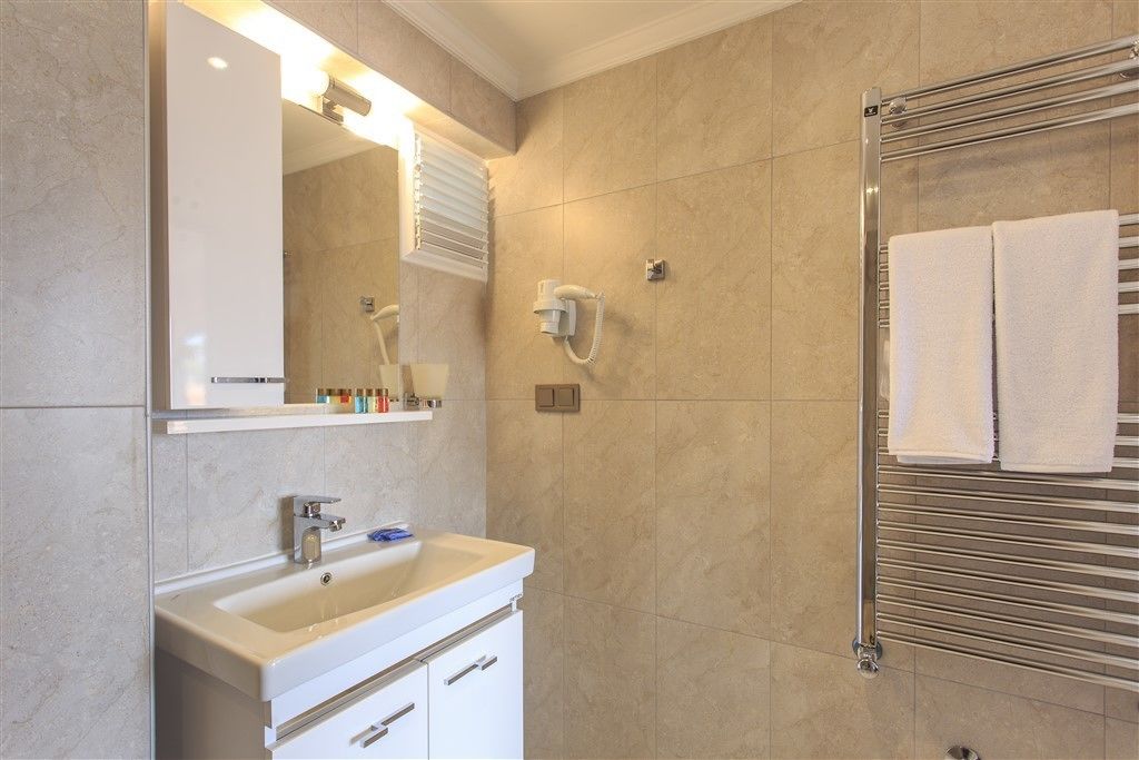 panoramic room, sea view | bathroom | designer toiletries, hair dryer, slippers, towels