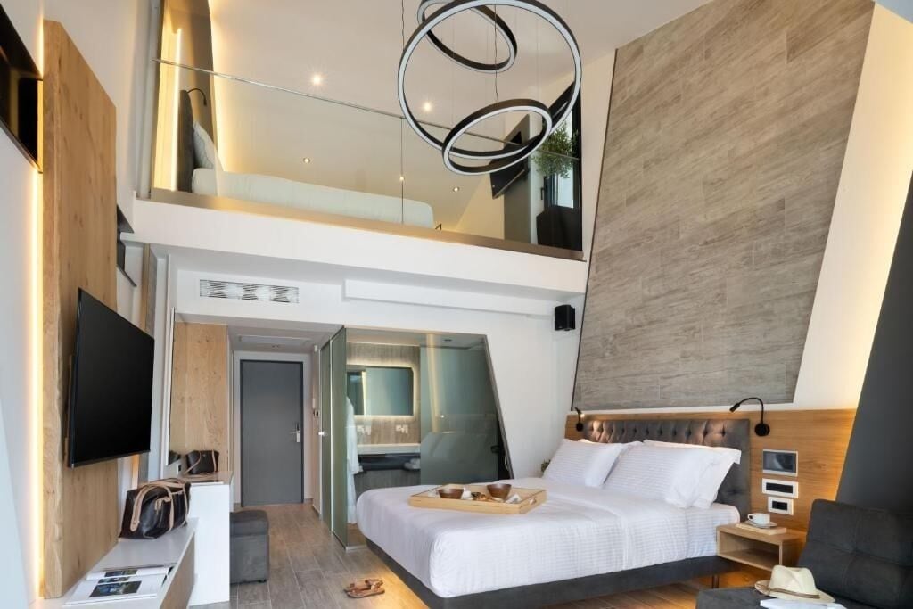 Suite Studio Exécutive, vue piscine | Literie de qualité supérieure, minibar, coffres-forts dans les chambres