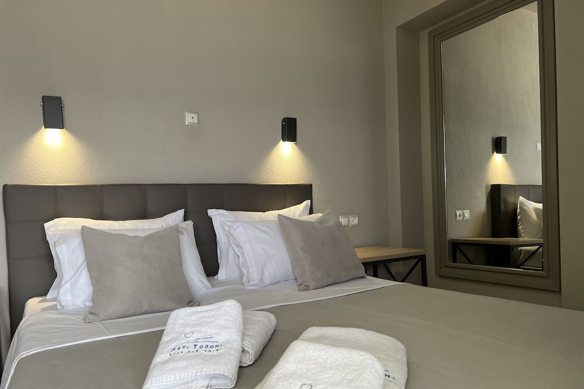 2 habitaciones, ropa de cama de alta calidad y minibar