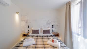 Premium bedding, desk, laptop workspace, free WiFi