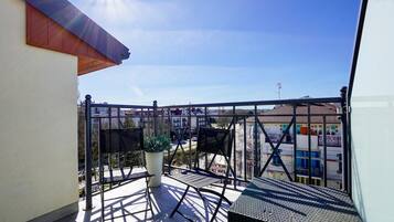 Deluxe Apartment, Multiple Beds, Partial Sea View | Balcony