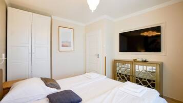 Deluxe Apartment, Multiple Beds, Partial Sea View | In-room safe, soundproofing, iron/ironing board, free WiFi