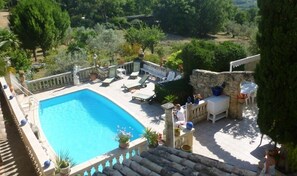 Seasonal outdoor pool, pool loungers