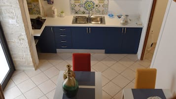Apartment, 1 Bedroom | Private kitchenette | Fridge, stovetop, coffee/tea maker, electric kettle